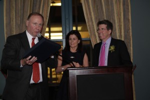 PiAf Board President presenting PiAf Medal to Bob and Jennifer Diamond