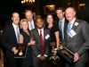 Tierneys Fred Swaniker and Jim Robinson with award at 2014 gala