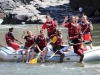 Fellows Kevin Nigarura, Joe Schmidt, and Julia Metzger white-water rafting on the Zambezi River.