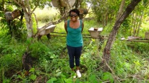 Alison standing in front of LWF's apiary management project.