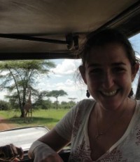 Liza with a giraffe, the pride of Tanzania, in the Serengeti National Park just 3 hours from where she lives