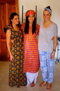 Camille, Lizzie Mulvey and Elise Knutsen at the home of one of their Senegalese co-workers, dressed in their best West African fabrics before celebrating the Muslim holiday of Tabaski.