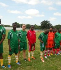 Sarah with her cotton and cashew coworkers at the annual Olam football tournament.