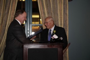 PiAf Board President Jim Robinson presenting PiAf Medal to Barry Segal