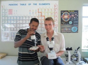 Thomas showing one of his students, Yasin, how not to use the microscopes.