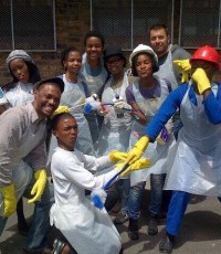 The youth department after cleaning restrooms as a part of a school sanitation campaign